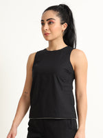 Organic Black cotton Closed neck sleeveless top with white piping detailing at the hem line.